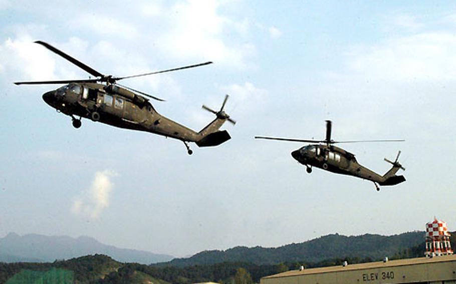 Helicopters from 2nd Battalion, 2nd Aviation Regiment, arrive at Camp Eagle, South Korea as part of a simulated air assault mission.