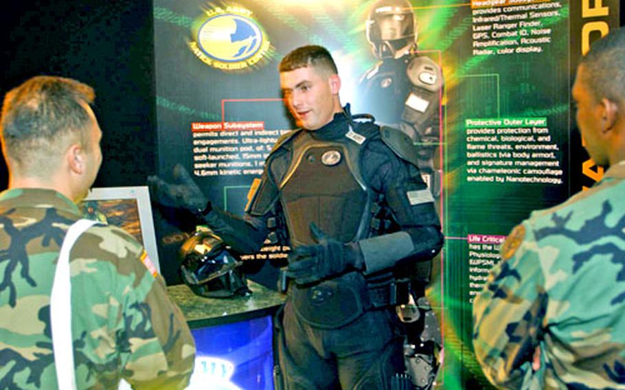 Staff Sgt. Raul Lopez, center, models a concept uniform being developed for soldiers of the future by the U.S. Army Natick Soldier System Center of Natick, Mass.