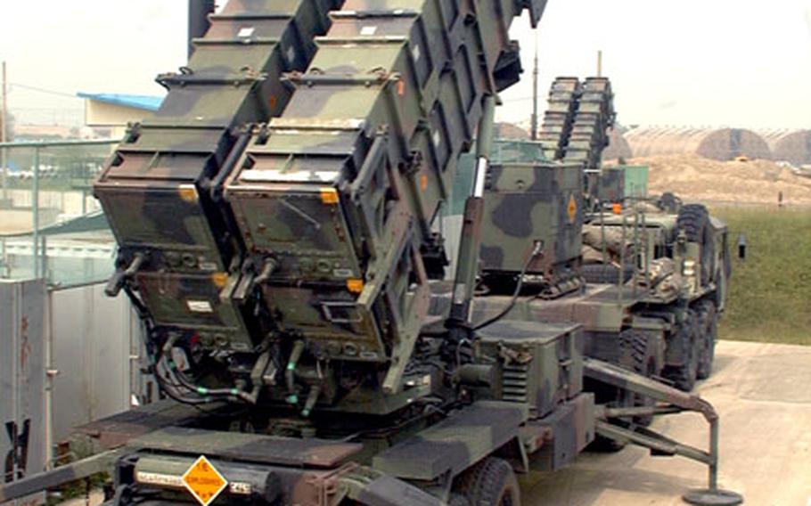 At Osan Air Base, South Korea, U.S. Army Patriot missiles poised skyward in their launch canisters last year. The U.S. Army will deploy additional Patriot batteries to South Korea later this month and combine all its Patriot batteries into a single Patriot brigade.