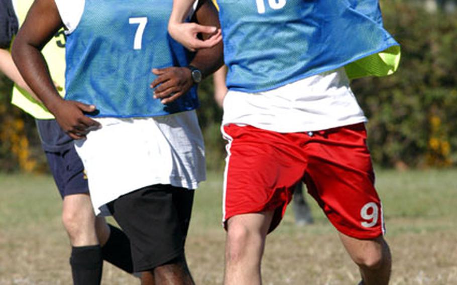 Mario A. Gomezsiercke (No. 10) dribbles the ball while Denzil E. D’Souza (No. 7) follows in support during a Taegu enclave intramural match. The two played for a team drawn from the 176th Finance Battalion and 516th Personnel Services Battalion. They beat the 19th Theater Support Command Team 4–2 earlier this month. An effort is under way to form an Area IV soccer club that would enable soccer lovers to play the game year-round.