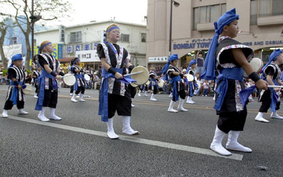 A Daiko drumming troupe made up of both American and Okinawan children performs during the Okinawa International Carnival on Sunday.