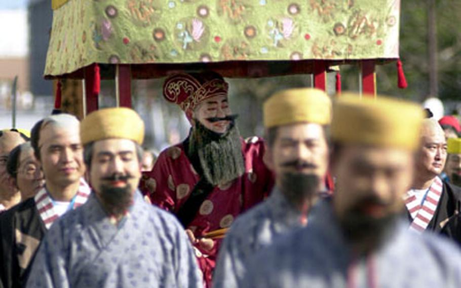 Okinawans perform a reenactment of a procession of envoys of Kingdom of the Ryukyus to Edo during Sunday&#39;s parade.