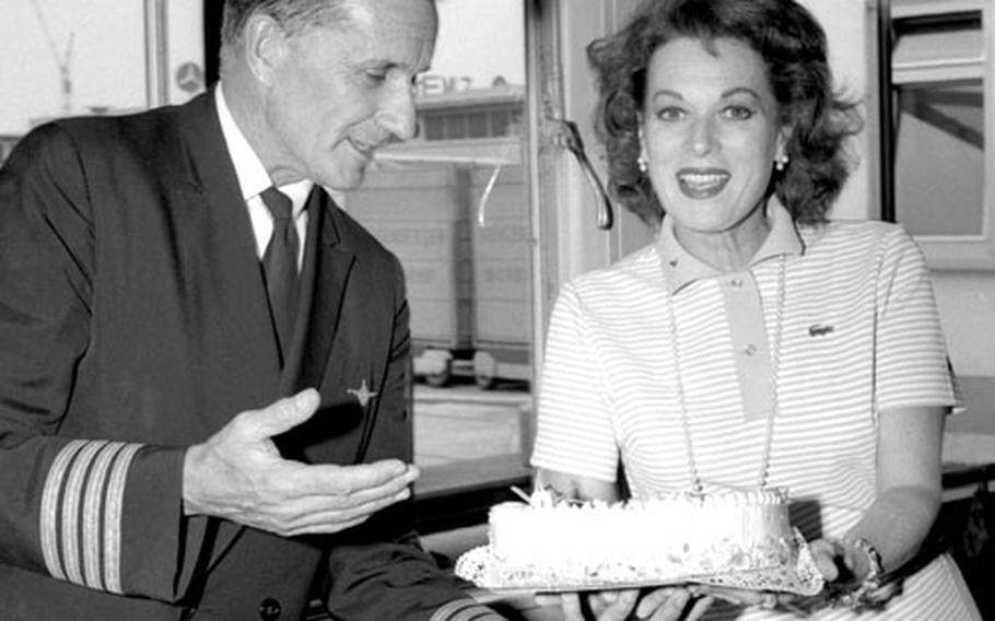 Actress Maureen O'Hara and her husband, airline pilot Charles F. Blair, during a stopover in Frankfurt on his retirement flight in July, 1969