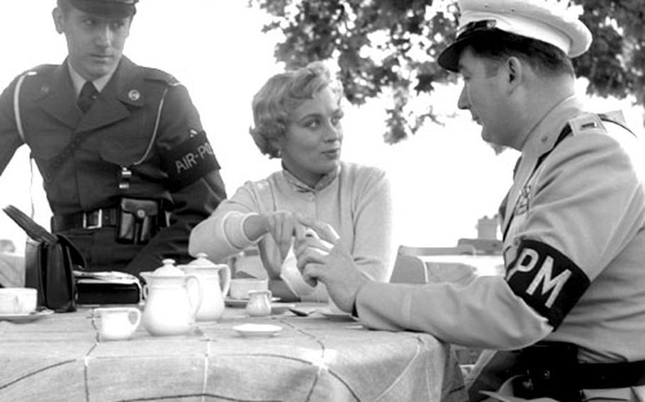 Actress Mai Zetterling with Lt. John Walsh, right the Berlin air provost marshal, and Staff Sgt. Luther Perry.