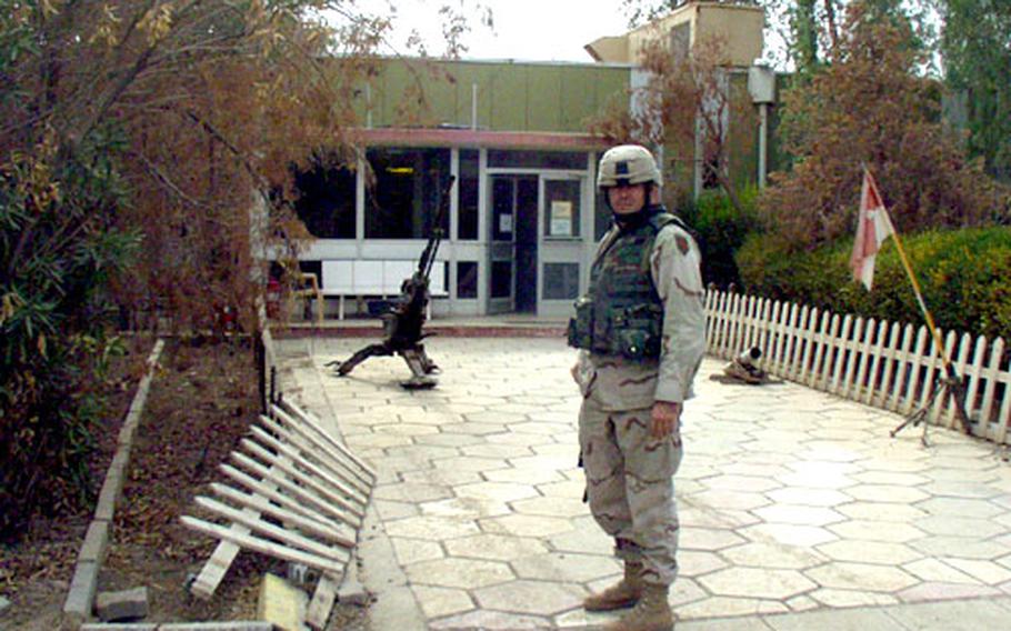 1st Sgt. Charles Biby, 35, stands in front of the headquarters building of Troop C of the 1st Squadron, 4th Cavalry Regiment at Forward Operating Base Wilson, Iraq.