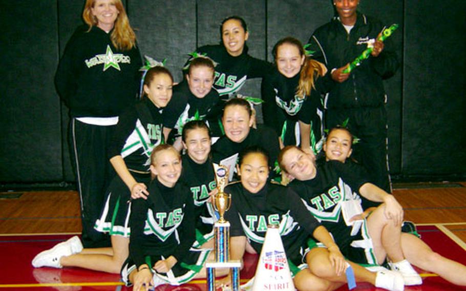 The varsity cheerleading squad of Taegu American School in Taegu, South Korea, poses after winning the Far East Cheerleading competition in the small school category, at Camp Zama, Japan, last week. The squad also earned an opportunity to take part in the National Cheerleading Championships in Dallas next month.