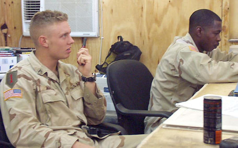 Sgt. Stefan Macchi, 23, of Orlando, Fla., and Staff Sgt. Bennie Pringle, 33, of Vienna, Ga., helped to build the little passenger terminal headquarters on the edge of the airfield at Camp Speicher in Tikrit, Iraq, last spring.