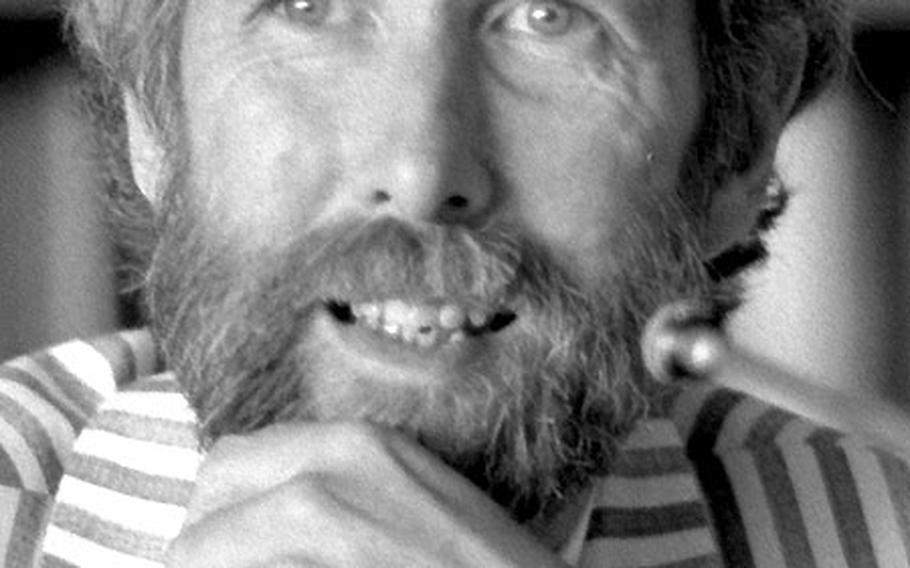 Jim Henson, creator of the Muppets, speaksto the Foreign Correspondents Club of Japan.