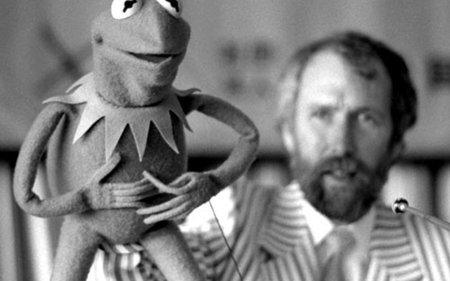 Jim Henson, creator of the Muppets, speaks (with an assist from Kermit the Frog) to the Foreign Correspondents Club of Japan.