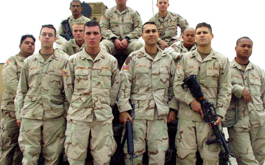 The soldiers of Shadow Platoon of the 1st Infantry Division’s 1st Battalion, 7th Field Artillery still mourn Spc. Joshua Henry, who died in an ambush Sept. 20. Front row, from left: Sgt. Collin MacInnes; Pfc. Kyle Hledinsky; Sgt. 1st Class Erick Macher; Capt. Jason Ebert; and Spc. Jarren Kealoha. Second row, from left: Pvt. Shannon Squires; Pvt. Michael Gallagher; and Spc. Jerome Braganaza. Back row, from left: Staff Sgt. Jose Rojo; Staff Sgt. Dan Sowell; and Spc. Travis Harney.