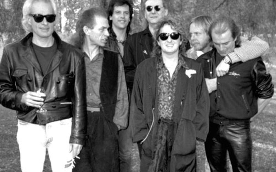 Art-rock musicians Yes at Frankfurt, Germany, in 1991. Left to right, Tony Kaye, Steve Howe, Trevor Rabin, Chris Squire, Jon Anderson, Rick Wakeman and Alan White.