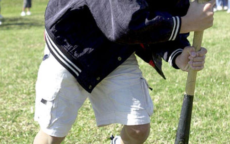 A sixth-grade student from Yonabaru Elementary School takes his turn at the “dizzy izzy” during a field day with fellow sixth-graders at Amelia Earhart Intermediate School on Kadena Air Base on Wednesday. More than 110 Yonabaru sixth-graders visited the school during a cultural exchange day.