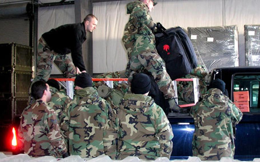 Airmen of the 554th Red Horse Squadron at Osan Air Base, South Korea, load the trucks they&#39;ll take on a deployment to tsunami-stricken South Asia.