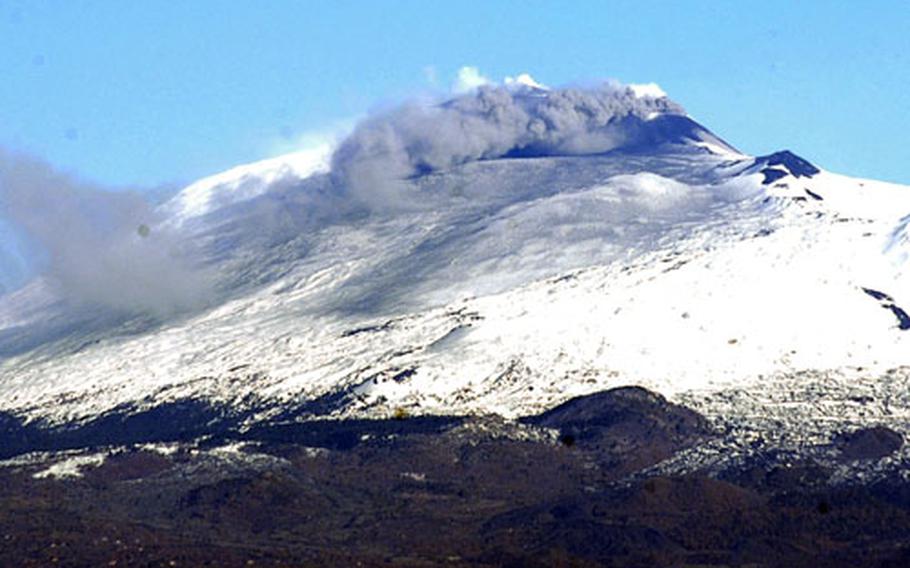 Smoke and ash roll out of Mount Etna, an active volcano, on Saturday. U.S. personnel assigned to Naval Air Station Sigonella were advised to avoid the area, but less ash was emitted than anticipated and the warning was lifted.