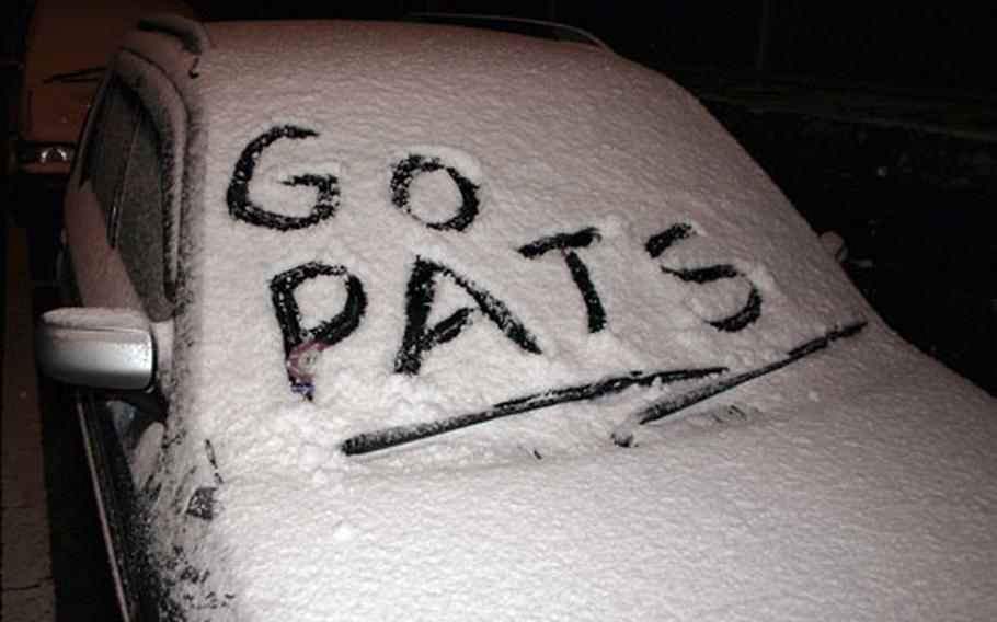A Sasebo Naval Base resident New England Patriots fan took the snowy opportunity Tuesday evening to post a slogan supporting his choice to win the Super Bowl.