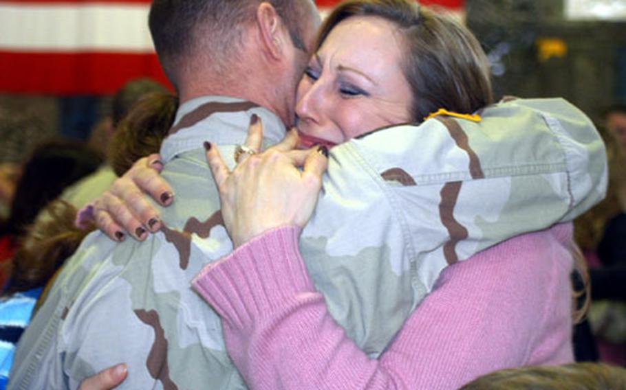 Sgt. Shawn Czarnecki hugs wife Cara at Katterbach Army Airfield in Germany. The family’s immediate plans were to “ETS to Arizona,” Cara Czarnecki said.