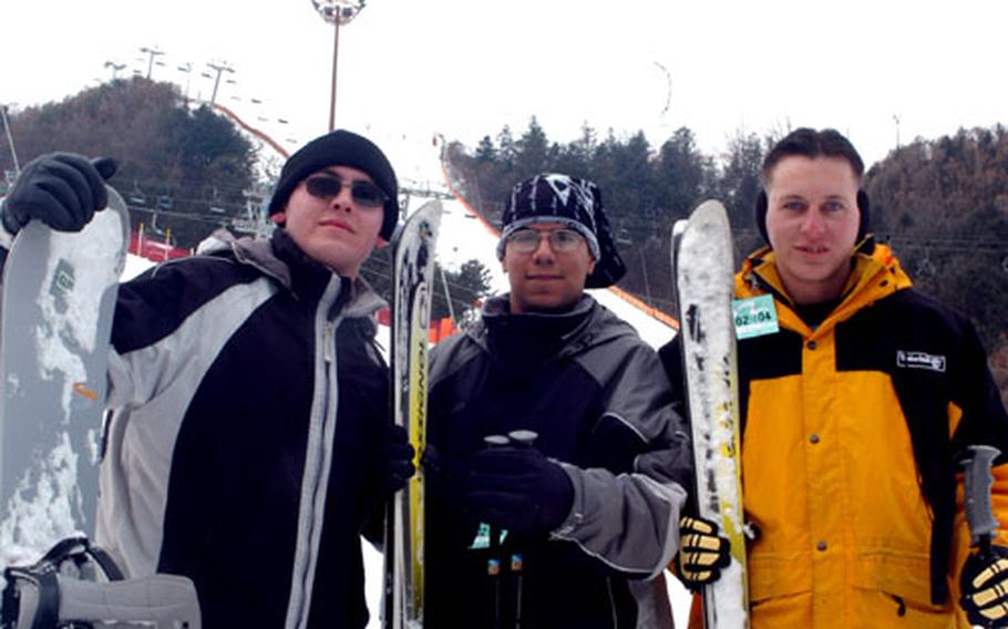 Camp Stanley soldiers, from left, Pvt. Robert James, Pfc. Manuel Romo and Pfc. John Essig take a break Friday from hitting the slopes at South Korea&#39;s Gangchon Resort ski area.