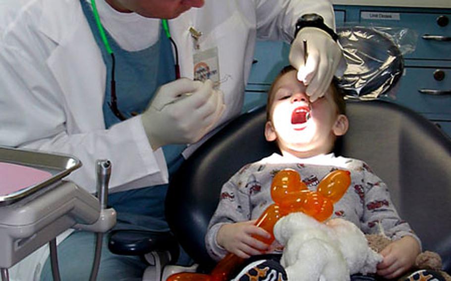 A young patient gets a dental exam during a past Dental Fun Day at the Evans Dental Clinic on Camp Foster, Okinawa. This year&#39;s Fun Day is slated for Feb. 26.
