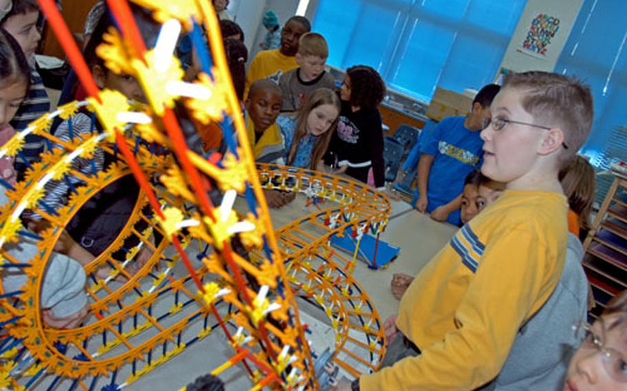 Ben Jacob discusses the physics of roller coasters for third- and fourth-graders at Cummings Elementary School, Misawa Air Base, Japan, on Thursday. Jacob was among a small group of fifth- and sixth-graders at Cummings who spent two months building two miniature roller coasters in their gifted education class.