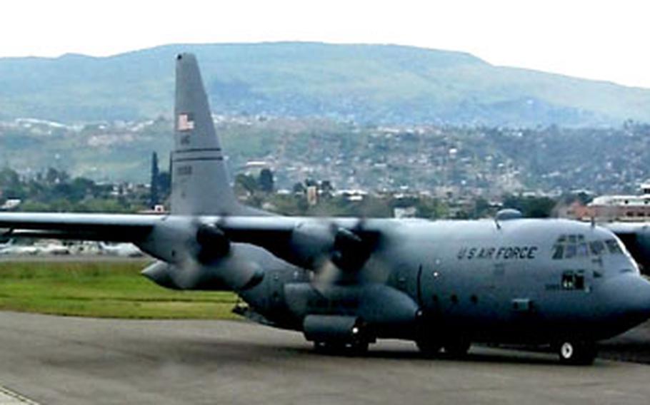 An Alaska Air National Guard C-130 Hercules taxis in Tegucigalpa, Honduras, in 1998. The Air Mobility Command has grounded or restricted half of its C-130Es.