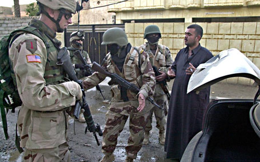 Staff Sgt. Clifford Jackson, left, at Forward Operating Base Wilson, Iraq, never wanted to work with Iraqi Army troops. “I wanted to be with my guys,” said Jackson, a scout. But helping build the Iraqi forces is his insurance policy, making sure he won’t have to come back again, said the 28-year-old soldier.