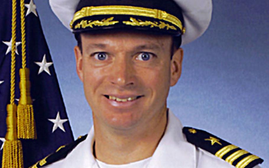 Cmdr. Kevin Mooney was stripped of his command and issued a letter of reprimand Saturday.