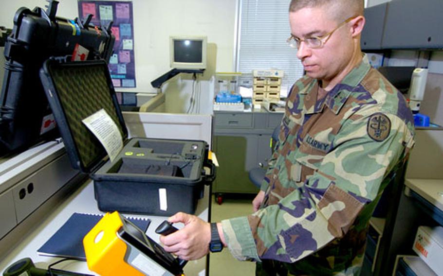 Capt. Aaron Miaullis, Chemical Biological, Radiological and Explosive Chief demonstrates a GR-130 gamma instrument analyzer that detects, measures and identifies nuclides involved in a risk assessment.