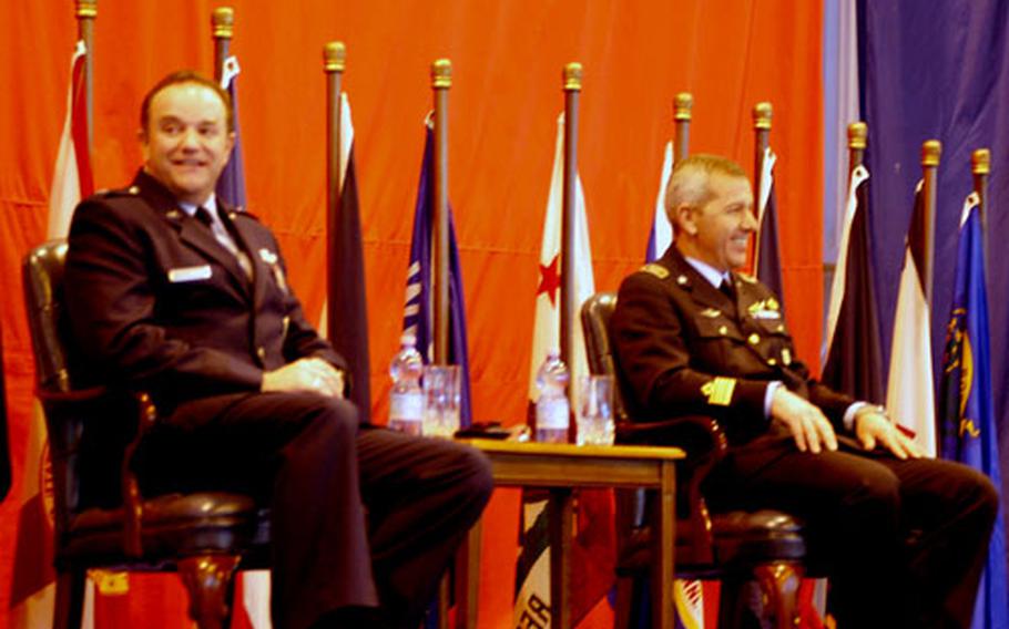 Brig. Gen. Philip Breedlove, left, of the 31st Fighter Wing commander, and Col. Rosario Scarpolini, the Italian base commander, mark the 50th anniversary Tuesday of American units at Aviano Air Base, Italy.