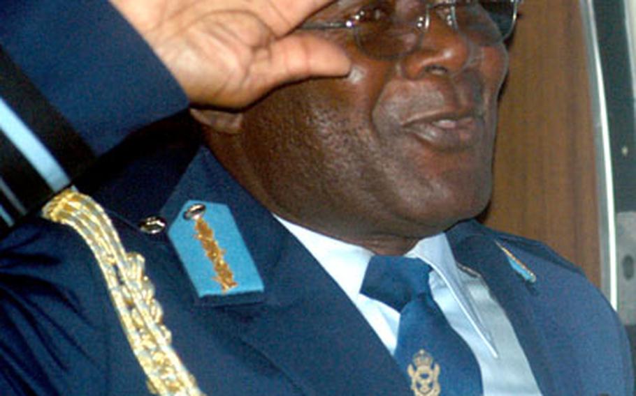Air Vice Marshal Edward Apau Mantey, head of the air force in Ghana, salutes Wednesday after returning to RAF Mildenhall, England, from a trip to Ramstein Air Base, Germany. The vice marshal is a guest of 3rd Air Force for the week.