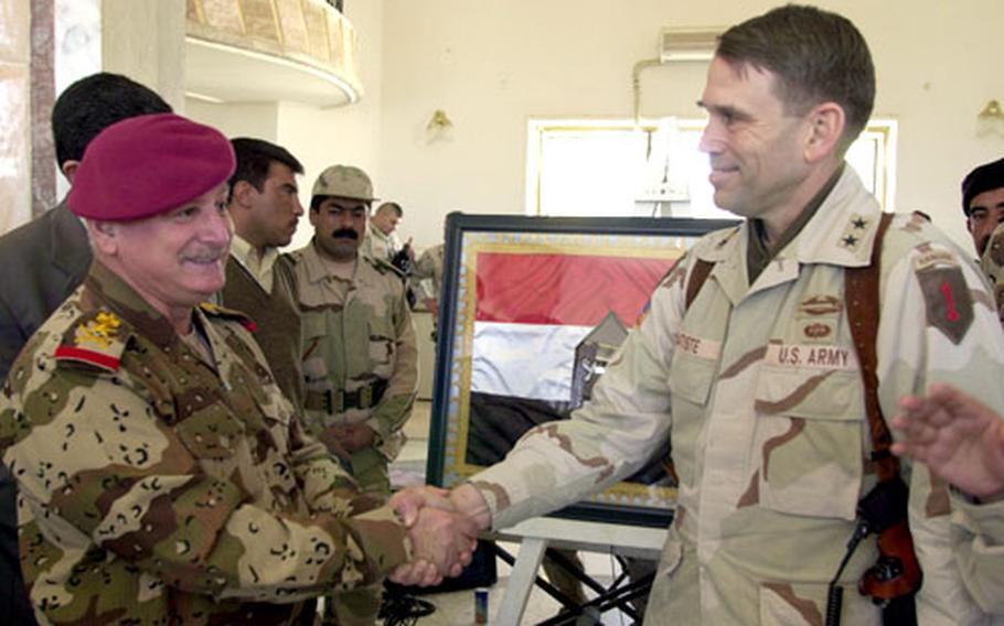 Finding dependable leadership is the most difficult part of building the new Iraqi army, says Maj. Gen. John R.S. Batiste, right. Commander of the new 4th Iraqi Division Lt. Gen. Abdul Rahman Azziz al-Mufti, shaking hands with Batiste, is an example of the best of the emerging leadership, Batiste said. “He seems to be a hell of a guy,” he added.