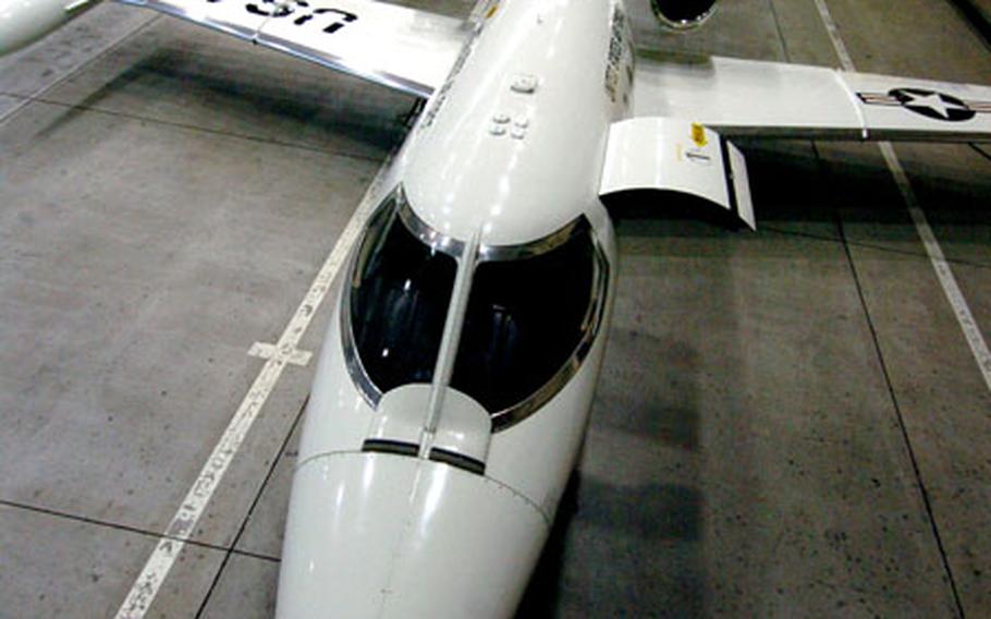 C-21 Lear jets, belonging to the 459th Airlift Squadron, sit in a hangar at Yokota Air Base, Japan. Two of the squadron’s C-21s deployed to South Asia for Operation Unified Assistance, flying 125 hours over 58 sorties.