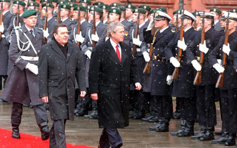 President Bush and German Chancellor Gerhard Schroeöder pass a military review in the courtyard of the Mainz Schloss at the beginning of the president&#39;s visit to Germany on Wednesday.