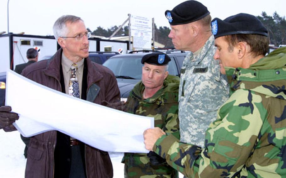 During their tour of Efficient Basing Grafenwöhr construction sites, Walter Bogdanow, deputy engineer for Corps of Engineers’ Southern Germany Area Office, left, provides details on the plans for the new Grafenwöhr Physical Fitness Center to, from left to right, Brig. Gen. Merdith “Bo” Temple, commander of Corps of Engineers North Atlantic Division, Lt. Gen. Carl Strock, U.S. Army chief of engineers and Col. Lee Staab, commander of the corps’ European District.
