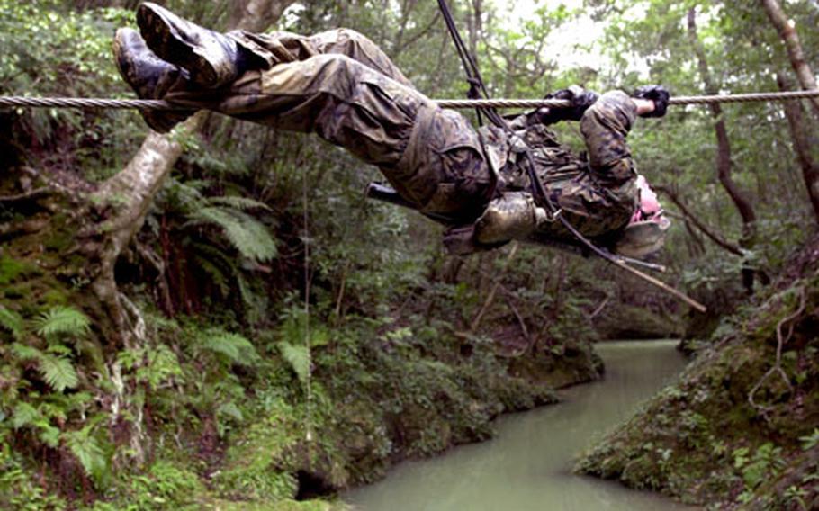 The “monkey crawl,” tests course participants’ ability to span a creek by inching across a suspended rope.
