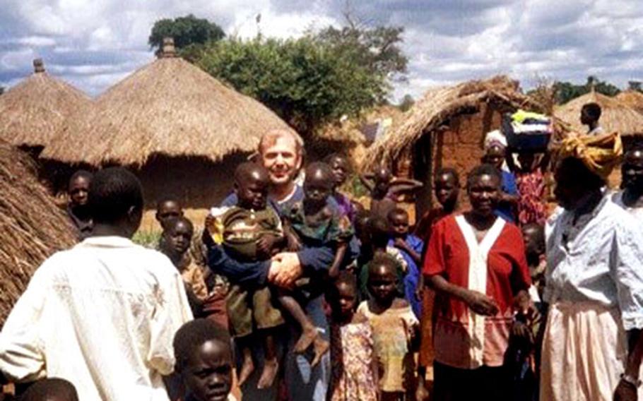 David Kenneth Waldman visits the Kamuli District in Uganda, Africa, during his visit in November. The children are orphaned, and many are handicapped or suffering with AIDS/HIV. Waldman helped set up a school in the area that serves 700 children.