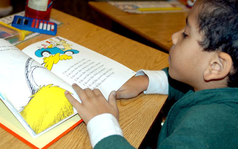 Jonathan Gray, a second-grader at Sollars Elementary School, reads a passage from a Dr. Seuss book Wednesday.