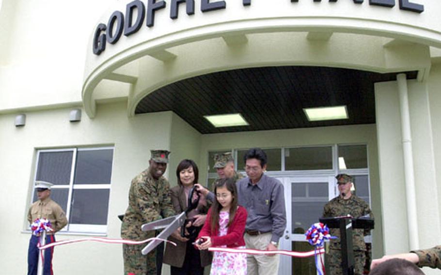 The ribbon officially dedicating the new 3rd Transportation Support Battalion headquarters building as Godfrey Hall is cut during a Wednesday morning ceremony on Camp Foster, Okinawa.