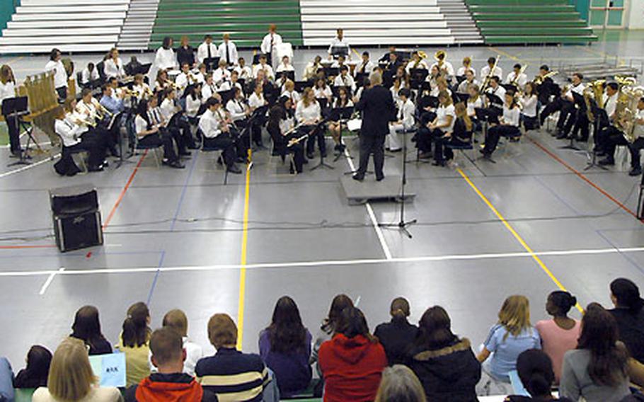 Bob Benson directs the combined Naples and Aviano high school bands. About 200 people attended the free concert, the first combined band event ever for the two schools.