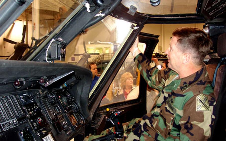 Sgt. First Class Paul Kagi, a helicopter mechanic assigned to the 2nd Battalion, 224th Aviation Regiment of the Virginia Army National Guard, tests visibility through the windshield of a UH-60 Black Hawk helicopter that had just received a new laminate designed to prolong the life of the windshield.