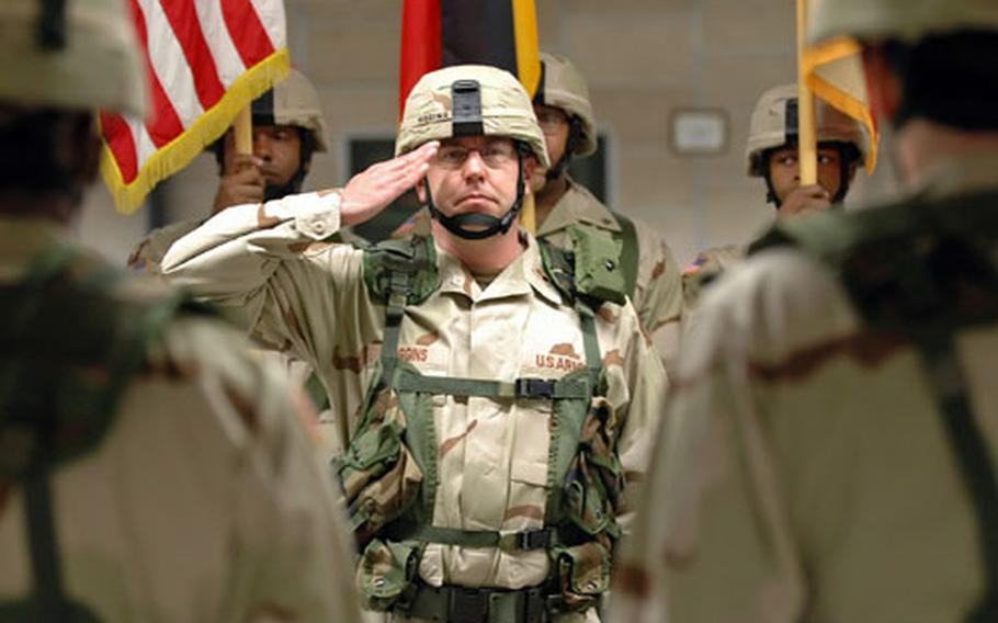 Lt. Col. Sean Higgins renders a salute at a casing the colors ceremony for the 29th Support Group in Kaiserslautern, Germany, on Friday. Higgins, the group’s deputy commander, and about 1,100 servicemembers will be deploying to Afghanistan in the coming months and will form the Joint Logistics Command.