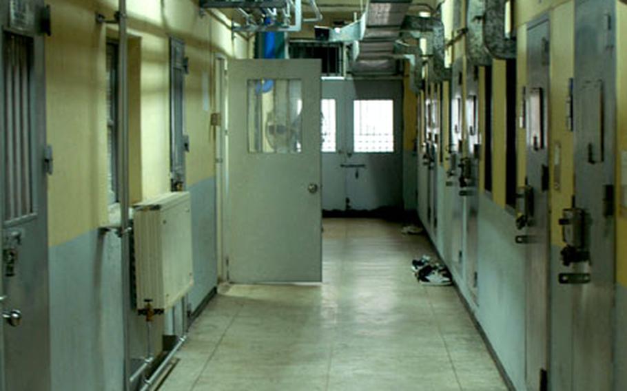 The cellblock where the U.S. prisoners stay looks exactly the same as surrounding cellblocks that house South Korean juvenile prisoners. U.S. inmates wear the same blue prison overalls as the South Korean prisoners but can own some clothes of their own, such as these Nike basketball shoes outside one of the U.S. cells.