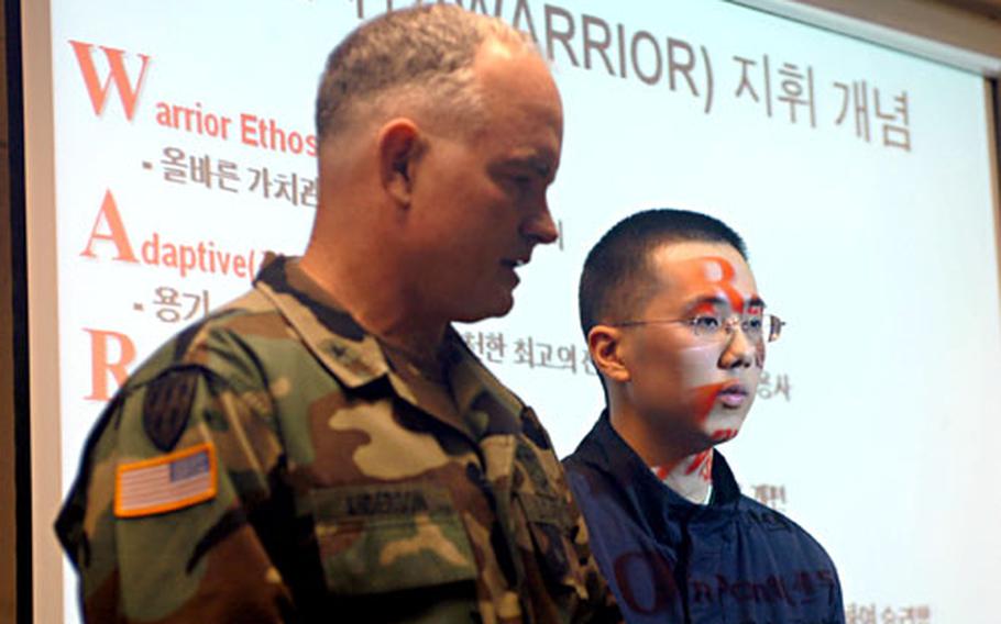 Brig. Gen. Charles A. Anderson, left, 2nd ID assistant division commander, briefs U.S. and South Korean media on changes to the Warrior Readiness Center with the help of a translator.