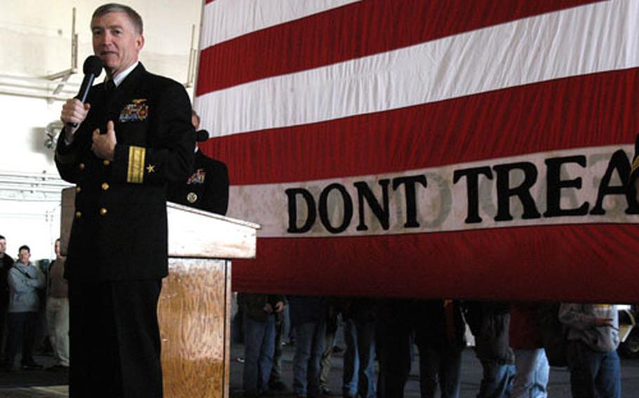 Rear Adm. James Kelly, Carrier Group Five commander, speaks at a news conference.