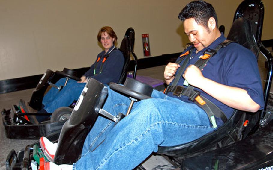Outdoor Recreation employees Carolyn Calter and Joshua Faiai get ready to test-run two Go Karts last week at the Weasel’s Den. The grand opening of the new indoor recreation center at Misawa Air Base, Japan, will be from 9:30 a.m. to 4 p.m. Saturday