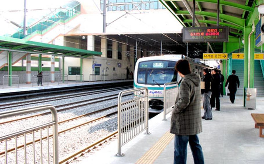 At Songtan Station, near Osan Air Base in Pyongtaek, South Korea, the Korean National Railroad’s No. 1. Metro subway pulls in Jan. 20, the day service began at the station. Osan airmen can travel from Songtan to Seoul for 1,600 won (about $1.60); the trip takes about 80 minutes.