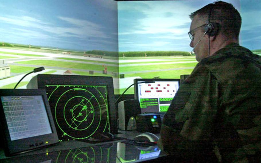 Air Force Tech. Sgt. Joseph Ames hones his air traffic control skills on a simulator at Spangdahlem Air Base, Germany.