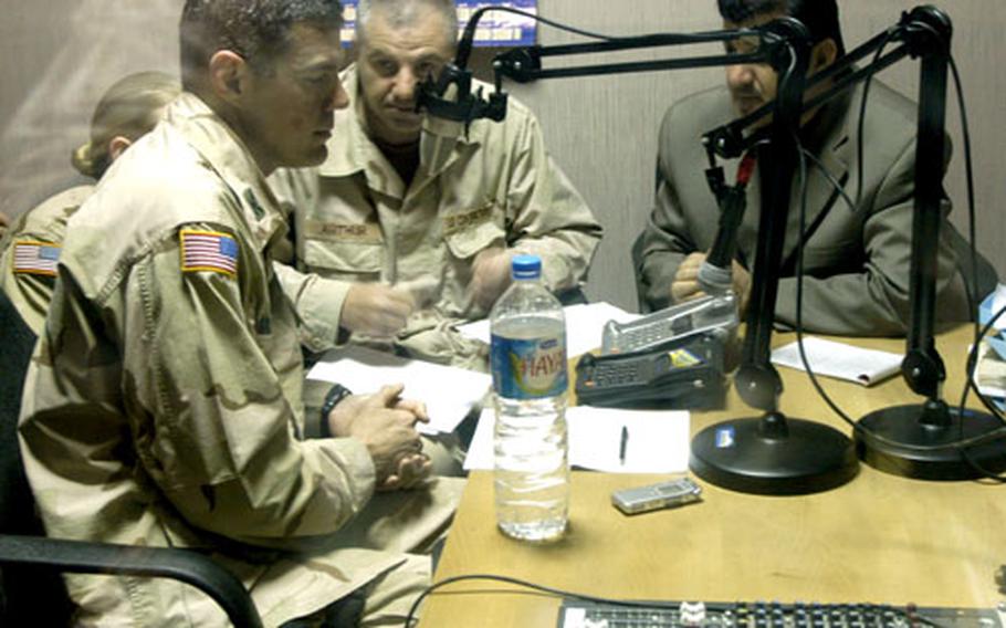 Col. Steven Salazar, left, commander of the 3rd Brigade Combat Team, answers questions from listeners during a radio show March 14 that was heard through the Baqouba region of Iraq. Mahmoud Rafeed, right, is the host of the program. His daughter was killed by insurgents.