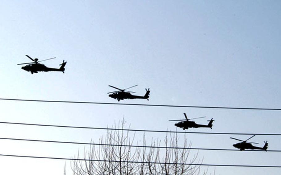 Apache helicopters from 1st Battalion, 2nd Aviation Regiment, leave Camp Page for the last time Tuesday.