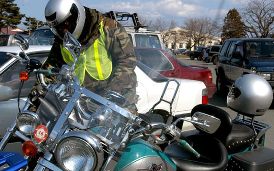 Staff Sgt. Tony Bunting parks his motorcycle outside Richard Bong Theater at Misawa Air Base, Japan, on Thursday before heading into a mandatory motorcycle briefing. It was the first day of Misawa’s riding season, which lasts until Nov. 15.