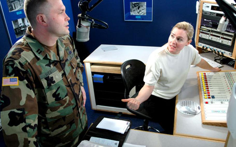 Army Chaplain (Capt.) Jay West began his radio ministry in March at AFN-Europe studios in Mannheim, Germany. His producer Mary Cochran, right, said the format of shows changes with each chaplain.